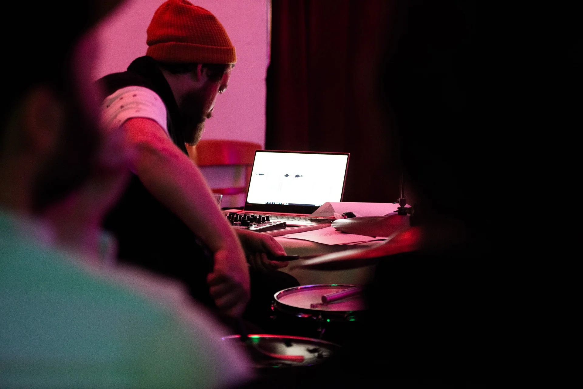 Markus Zink performing with drums, a laptop and electronic controls